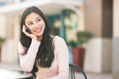woman calling Go Dentistry to schedule a dental appointment